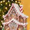 Glitzhome® 11.75" Christmas Lighted Resin Village Table Decor